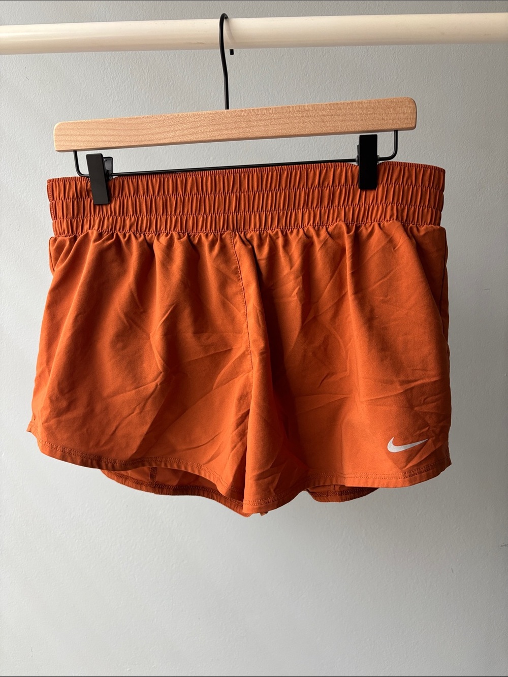 Nike Women's Orange DRI-FIT Athletic Shorts with Silver Swoosh